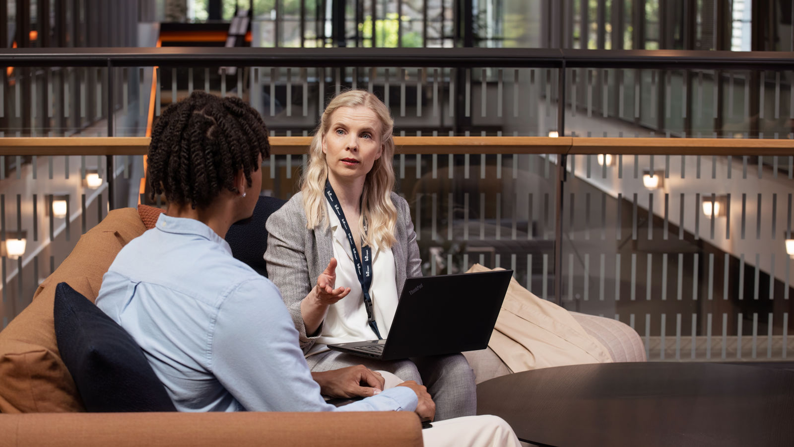 Man and woman sitting in a office space